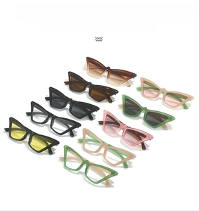 Detailed view of fashion cat-eye sunglasses in various candy colors and glossy finishes