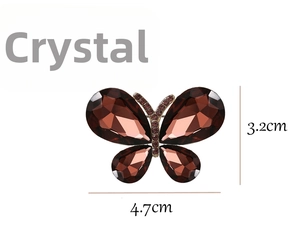 Detailed close-up showing butterfly brooch dimensions 4.7cm by 3.2cm with amber crystals