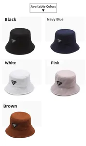 Detail showing five colors of bucket hats with textured fabric and triangle logos