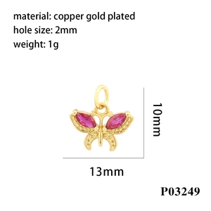 Detailed size view of a 13mm gold butterfly pendant with red cubic zirconia stones