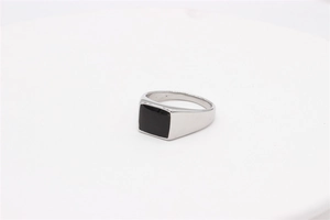 Detail view of square black onyx stone inlay on a polished silver stainless steel ring