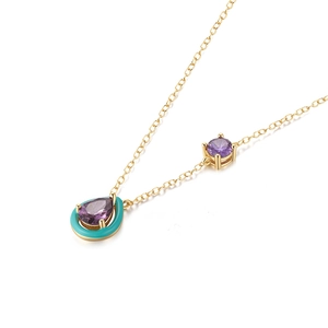 Detail of S925 silver necklace with purple teardrop gem and blue enamel accents