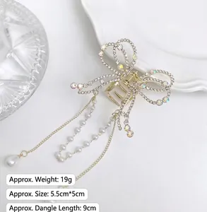 Detailed macro view of butterfly hair claw with tassels, rhinestones and dimensions