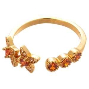 18k gold plated open ring with orange zircon butterfly and star motifs on white background