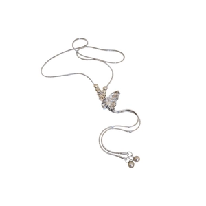 Silver butterfly necklace with round beads, snake chain, and elegant tassel fringe detail