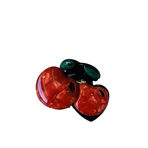 Retro cherry acetate hair claw clip with dark red marble texture and green leaves