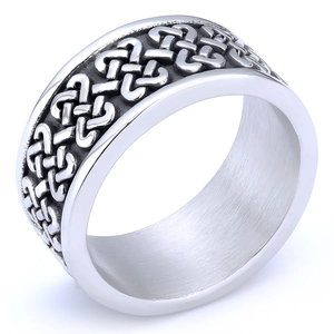 Detailed close-up of a silver stainless steel ring with intricate Celtic knot engraving