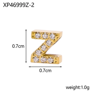 Detailed macro view of gold letter Z charm with micro-paved cubic zirconia, 0.7cm size