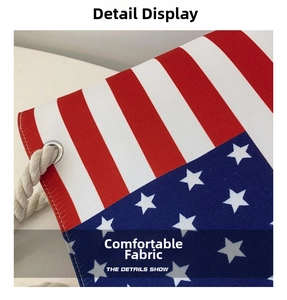 Detail of canvas tote bag showing American flag pattern, silver eyelet, and white drawstring