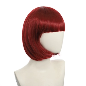 Detail of red short bob wig with straight bangs on a mannequin head against white background