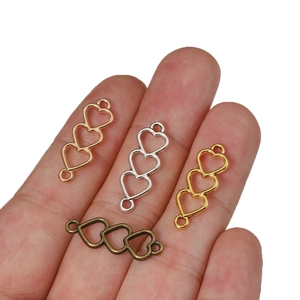 Three hollow hearts link connectors for DIY jewelry making in assorted metal finishes