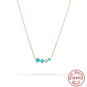 Detail view of gold S925 sterling silver chain with turquoise beads and zircon pendant
