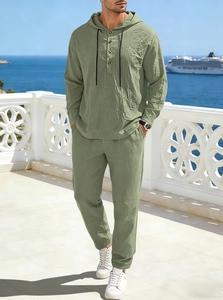 Detail of sage green linen two-piece set featuring hooded long sleeve top and drawstring pants