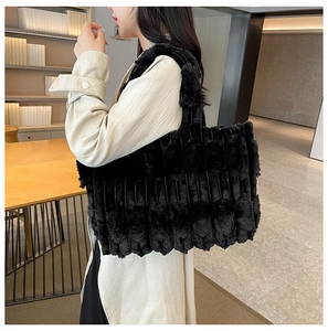 Detail of black faux fur tote bag showing plush ribbed texture and large capacity