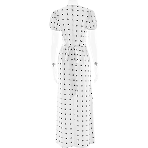 Detail of a white French polka dot maxi dress featuring a tie-up bow on the back