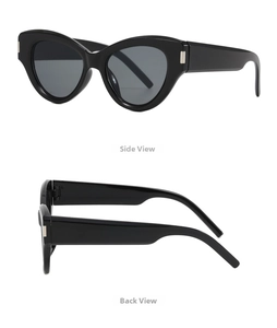 Detail of black cat-eye sunglasses with glossy resin frame and silver metal accents