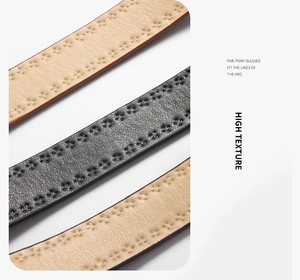 Macro detail of PU leather belts featuring floral punch-hole patterns and double stitching