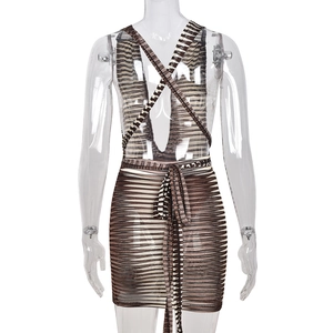 Detail view of the halter neck tie and open back design on the striped knitted dress