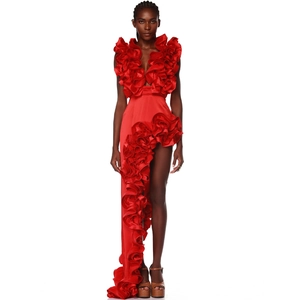 Detail view of red V-neck swimsuit with layered ruffles and asymmetric hemline