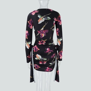 Detailed back view of leopard floral dress featuring ruched tailoring and elegant streamers
