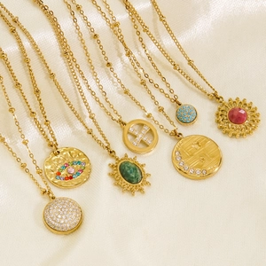 Collection of seven 14K gold plated necklaces with turquoise and malachite pendants