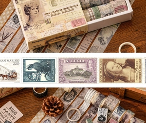 Detail of vintage washi tape set featuring classical newspaper and stamp designs