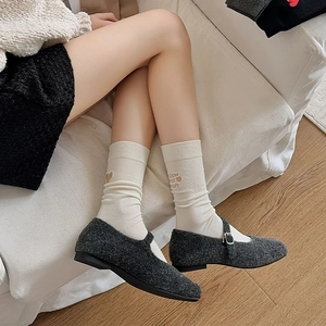 Women's white crew socks with heart embroidery and Follow Your Heart text detail