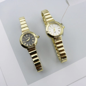 Elegant gold quartz ladies watch set with Roman numerals and crystal bezel details