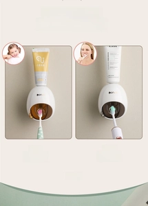 Detail view of wall-mounted automatic toothpaste dispensers for kids and adult toothpaste