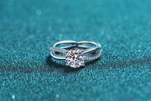 Detailed view of 1-carat moissanite ring with intertwined bands and micro-pavé diamonds
