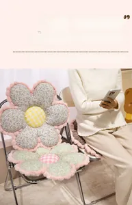 Close-up of thick floral plush seat cushion with soft petal design on a chair