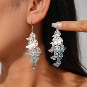 Silver hollow butterfly tassel earrings with blue gradient for a retro ethnic look