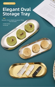 Macro detail of Nordic gold stainless steel oval tray with smooth mirror finish texture