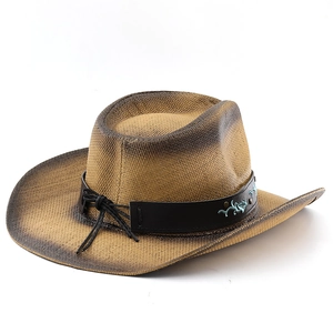 Detail of western straw cowboy hat featuring woven texture and gradient brim finish
