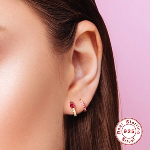 Close-up of S925 sterling silver gold hoop earrings with colorful water drop pendants