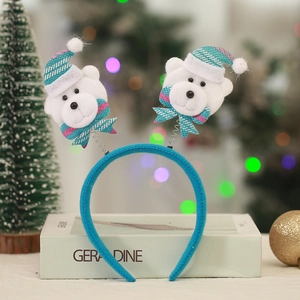 Blue Christmas headband featuring white plush bears with Santa hats and striped bows