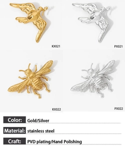 Detailed macro view of bee and dove brooches in polished gold and silver steel finish