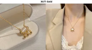 Detail of gold Ruyi lock necklace with white shell inlay and golden ball tassels