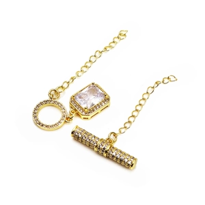 Macro view of gold-plated OT toggle clasp with micro-set cubic zirconia and square pendant