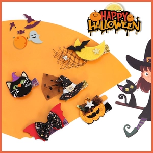 Detail of Halloween hair clip set with pumpkin, ghost, and sequin bow for kids