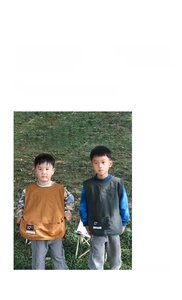 Detail of waterproof kids art smock vest with functional pockets and durable fabric