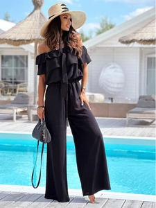 Detail of a chic black off-shoulder jumpsuit with drawstring waist and wide-leg design