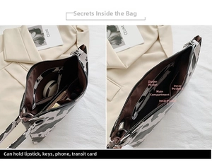 Detailed interior of leopard print clutch showing inner pockets and storage space