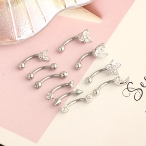Detailed set of silver stainless steel piercing jewelry with white cubic zirconia accents