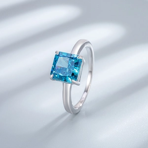 925 sterling silver ring featuring a square cut sky blue gemstone with brilliant fire
