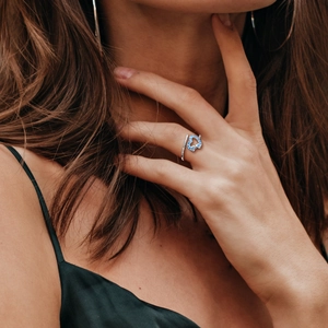 Blue heart S925 sterling silver open ring with pavé diamond band on a model hand