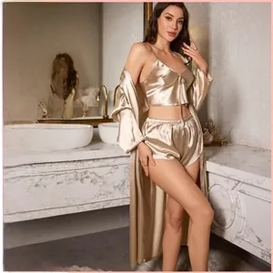 Detail view of champagne silk pajamas three-piece set featuring camisole, shorts, and robe