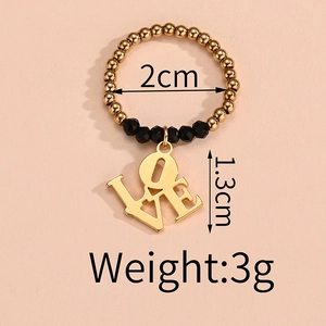 Detail view of elastic beaded ring with LOVE charm, 2cm diameter and 1.3cm pendant height