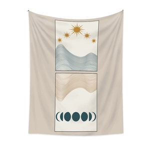 Detail of bohemian wall tapestry featuring sun moon phases and abstract wave patterns