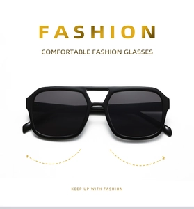 Close-up of black square aviator sunglasses with double bridge frame and dark lenses